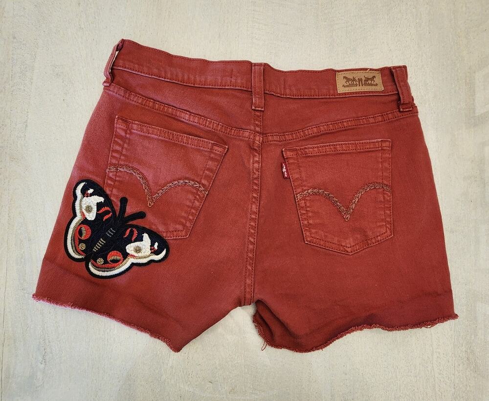 Levis Women's Cut off Denim Shorts SZ 4 Distressed Butterfly Patch Rust